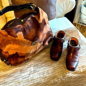 1am selling a pair of Frye short cowboy boots with a dolce and Gabbana bag